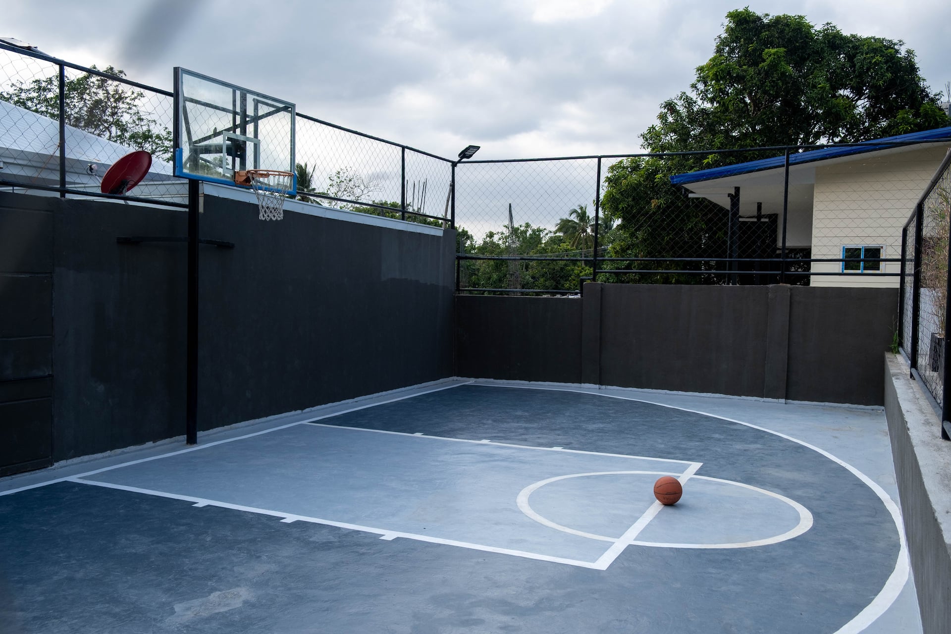 Private Half-Court Basketball Court with Regulation Glass Backboard