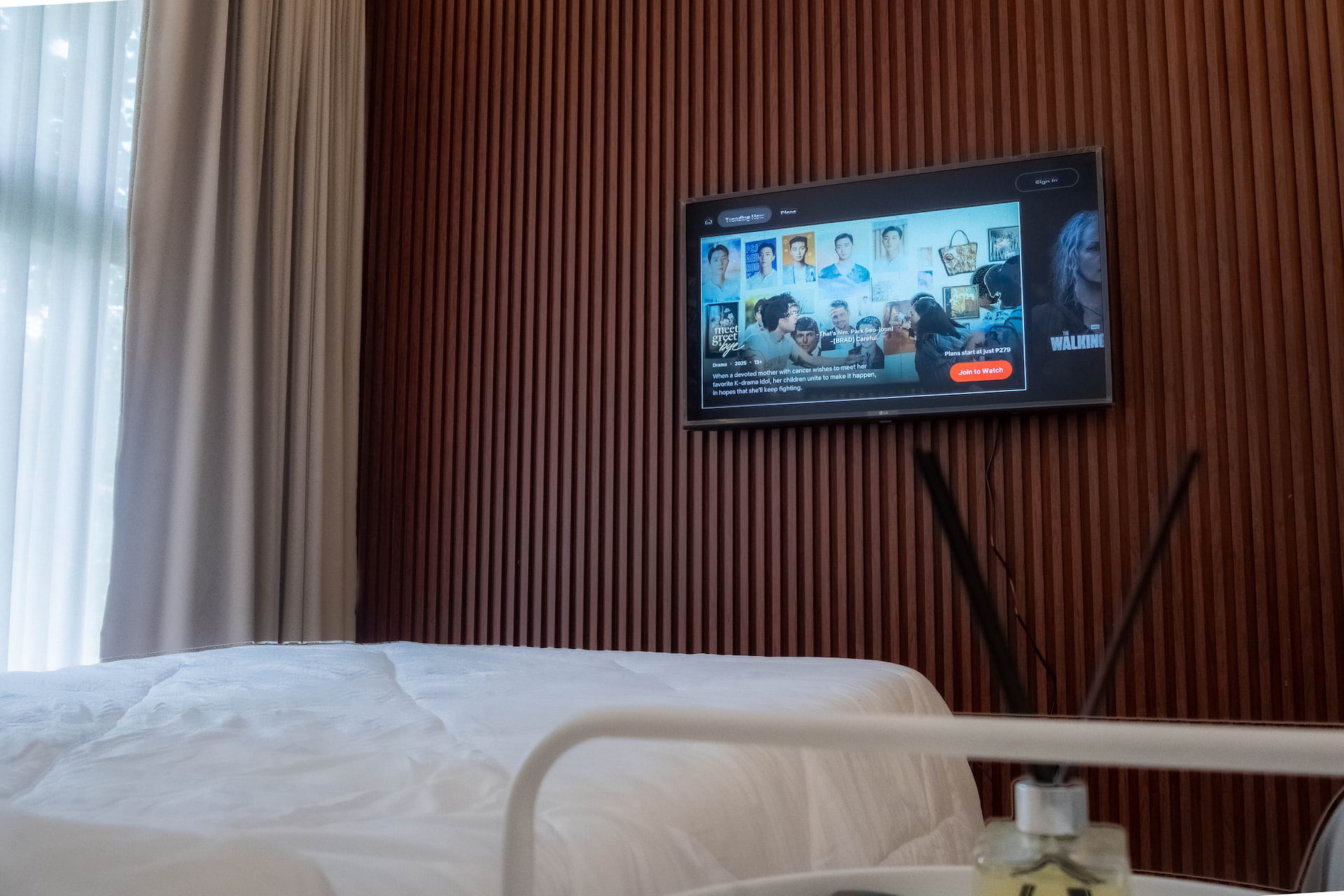 VIP Master Suite Wall-Mounted Smart TV on Fluted Wood Accent Wall