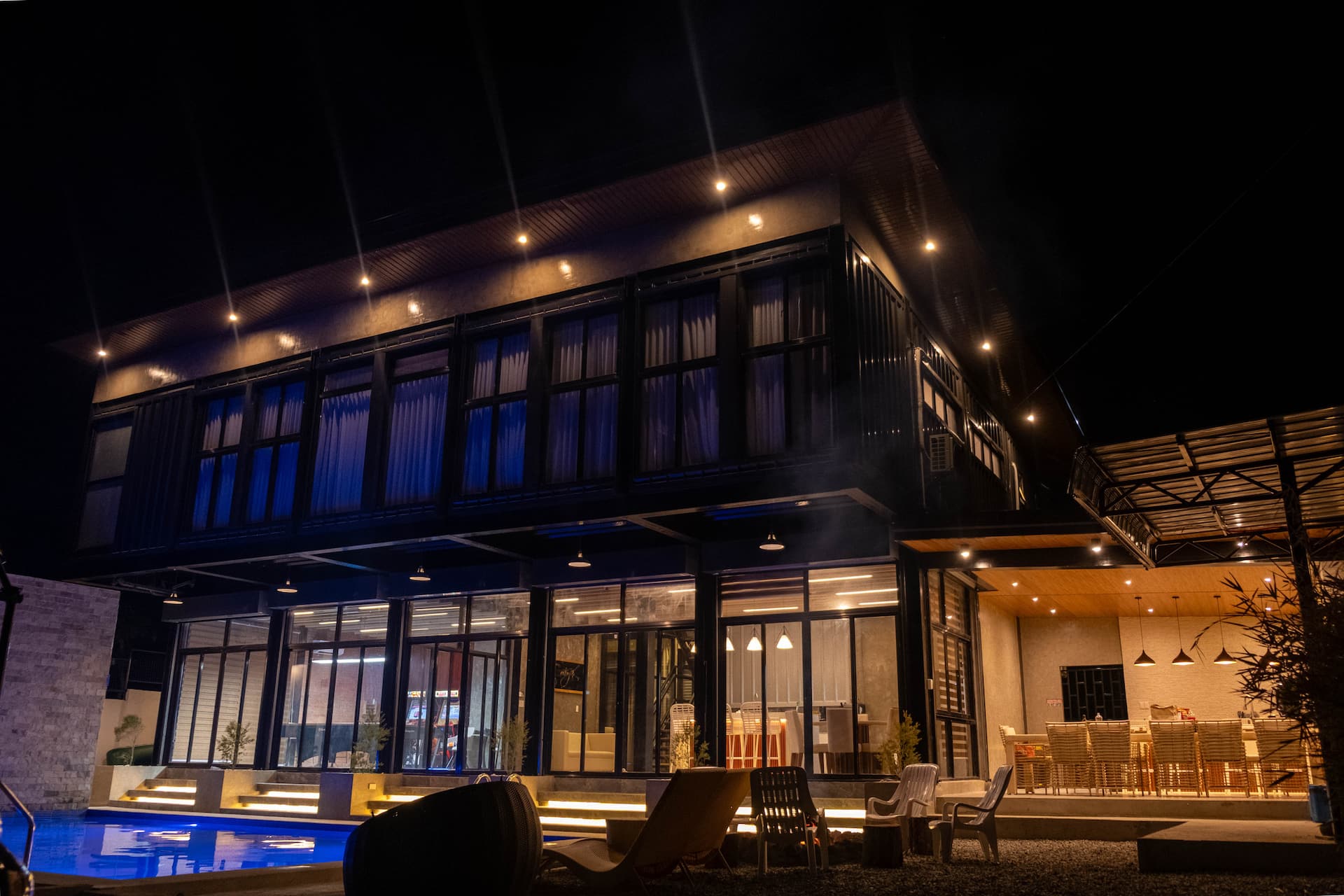 Illuminated Villa Facade with Ambient Garden Lighting