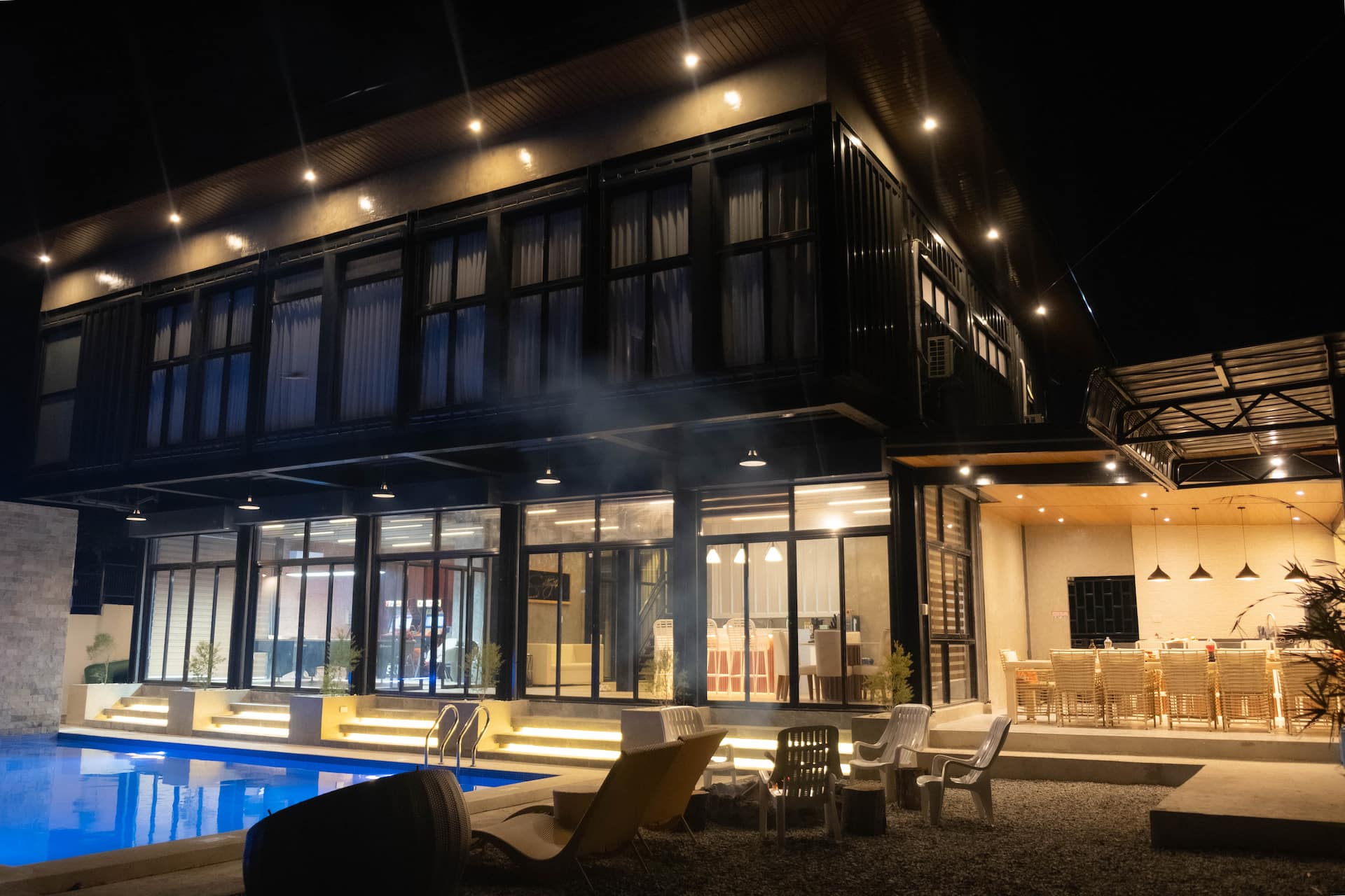 Poolside Villa Exterior with Illuminated Under-Step Lighting
