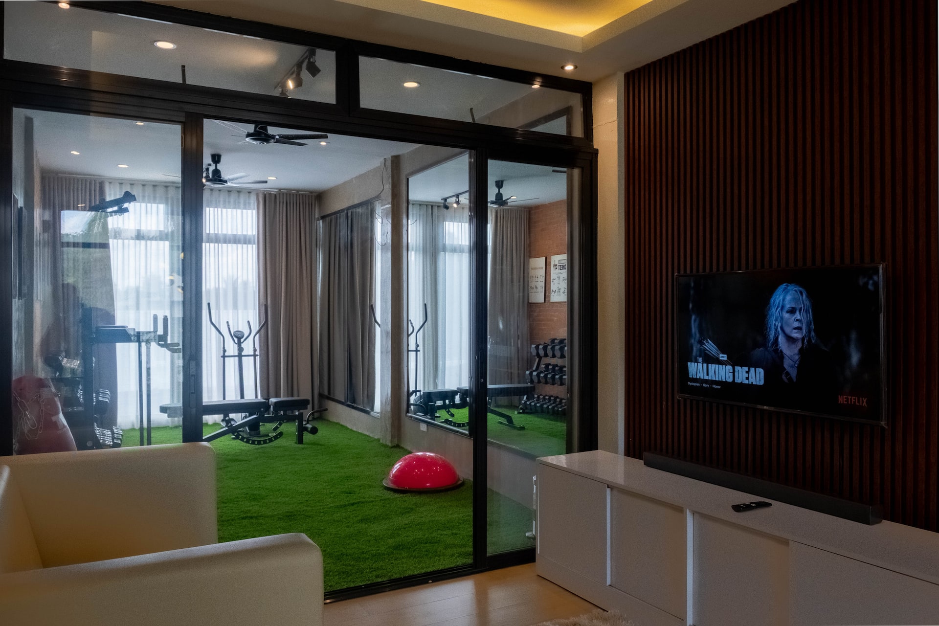 Glass-Enclosed Gym Access from Private Lounge