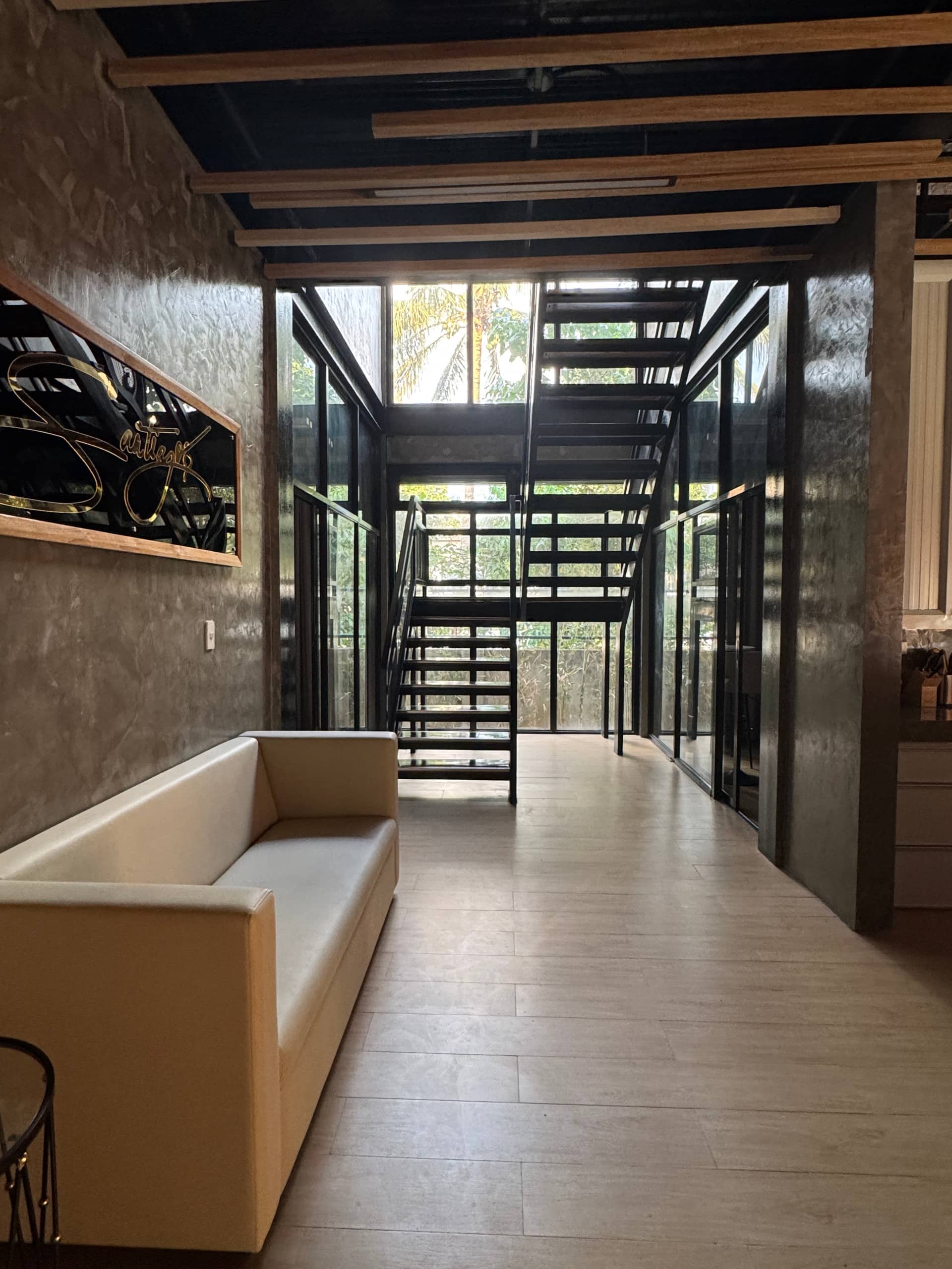 Ground Floor Atrium Lounge with Gold Santiago Crest & Floating Stairs