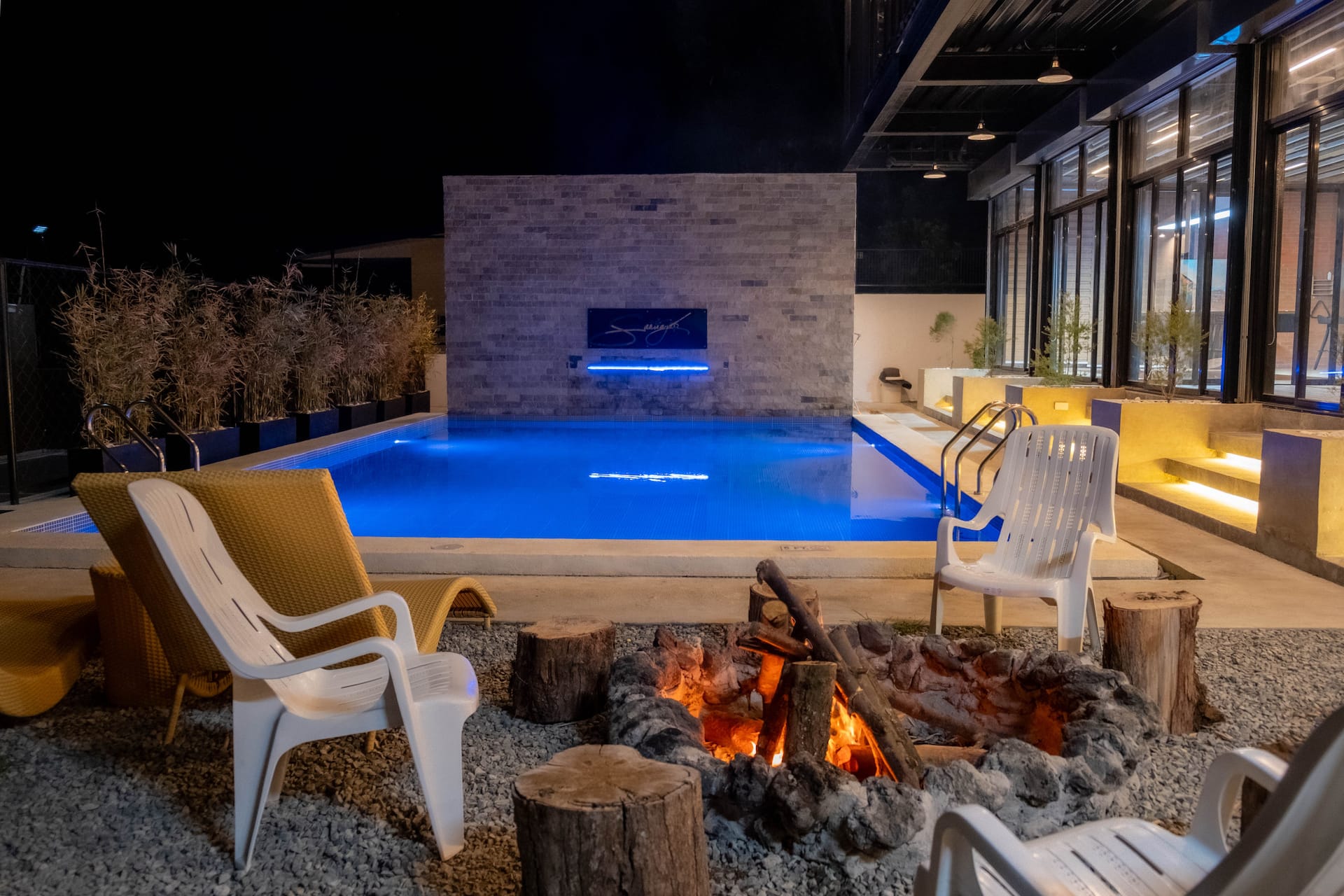 Night Bonfire Pit with Blue LED Illuminated Swimming Pool