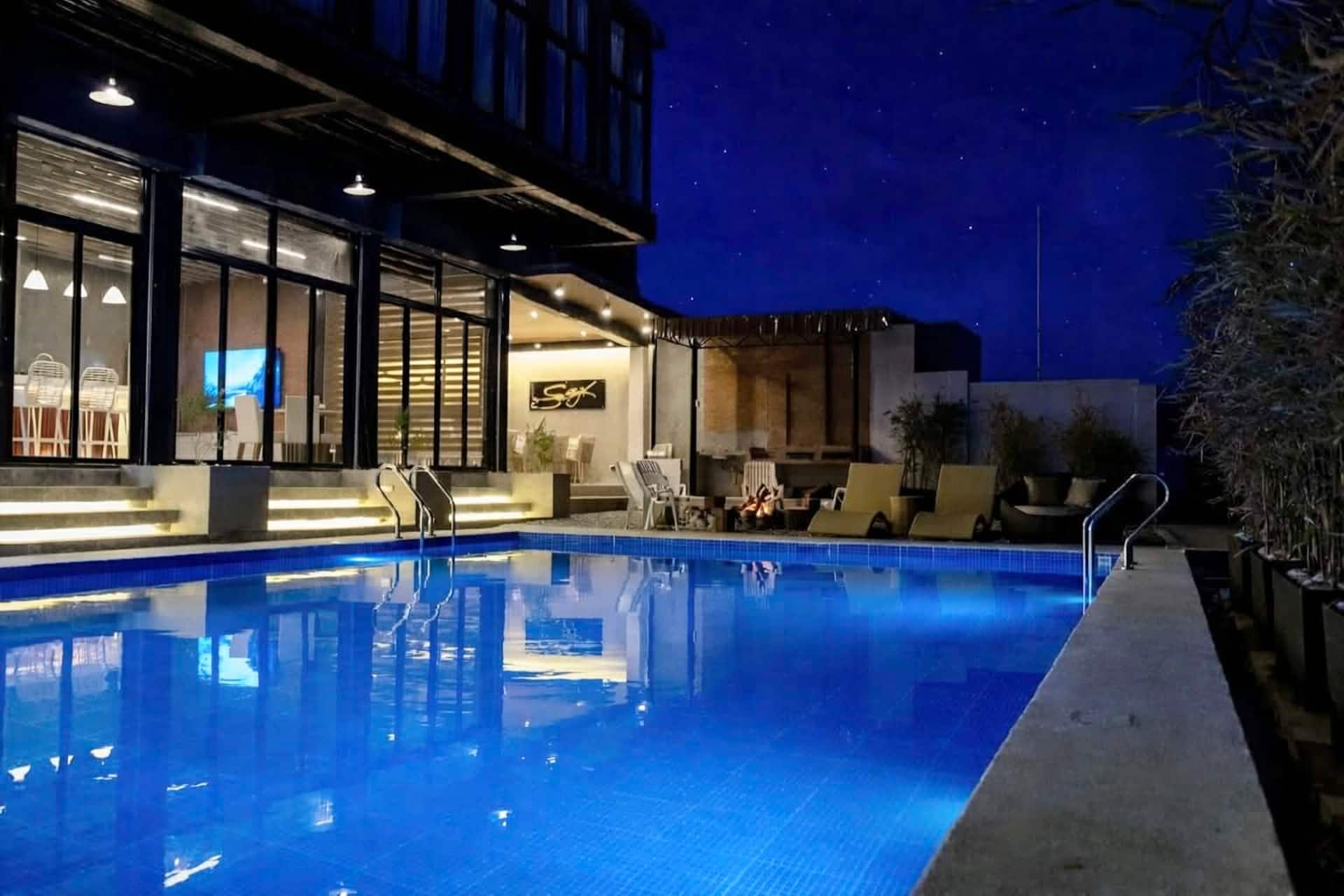 Starry Night Poolside with Turquoise Water & Villa Steps